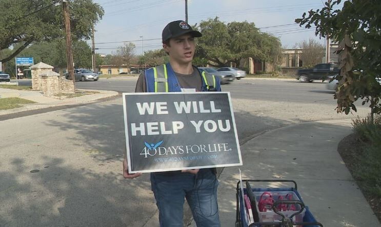 John With Sign Jpg